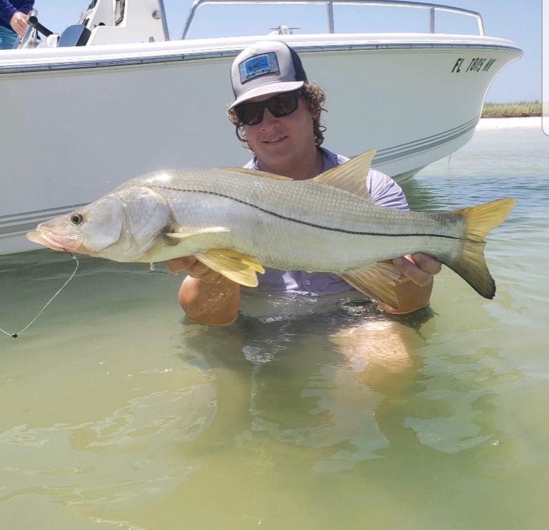 Summertime snook fishing success on the beach